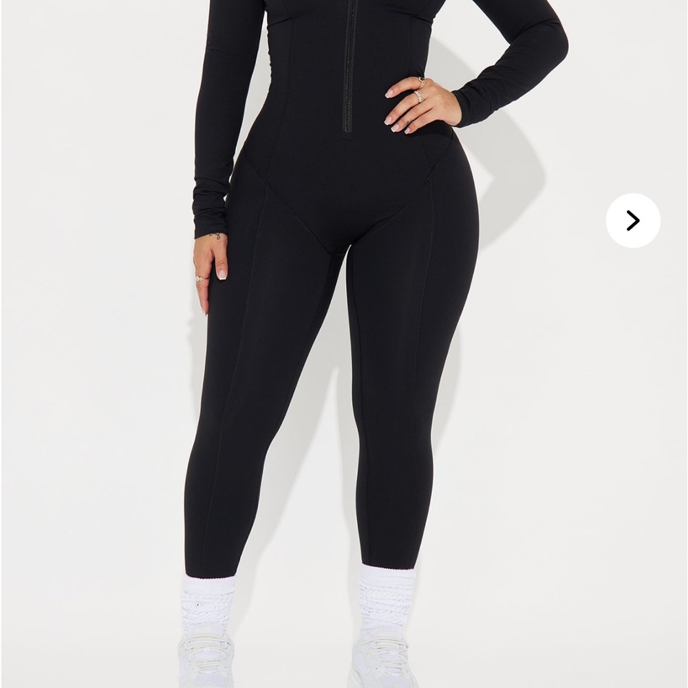 Black Form-Fitting Jumpsuit with Long Sleeves and High Neckline